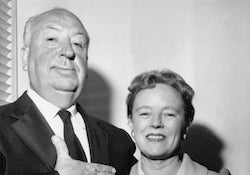 Alfred and Alma Hitchcock pose for a picture together